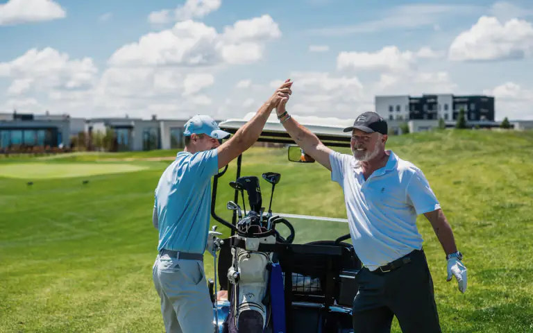Golfers celebrating together after play