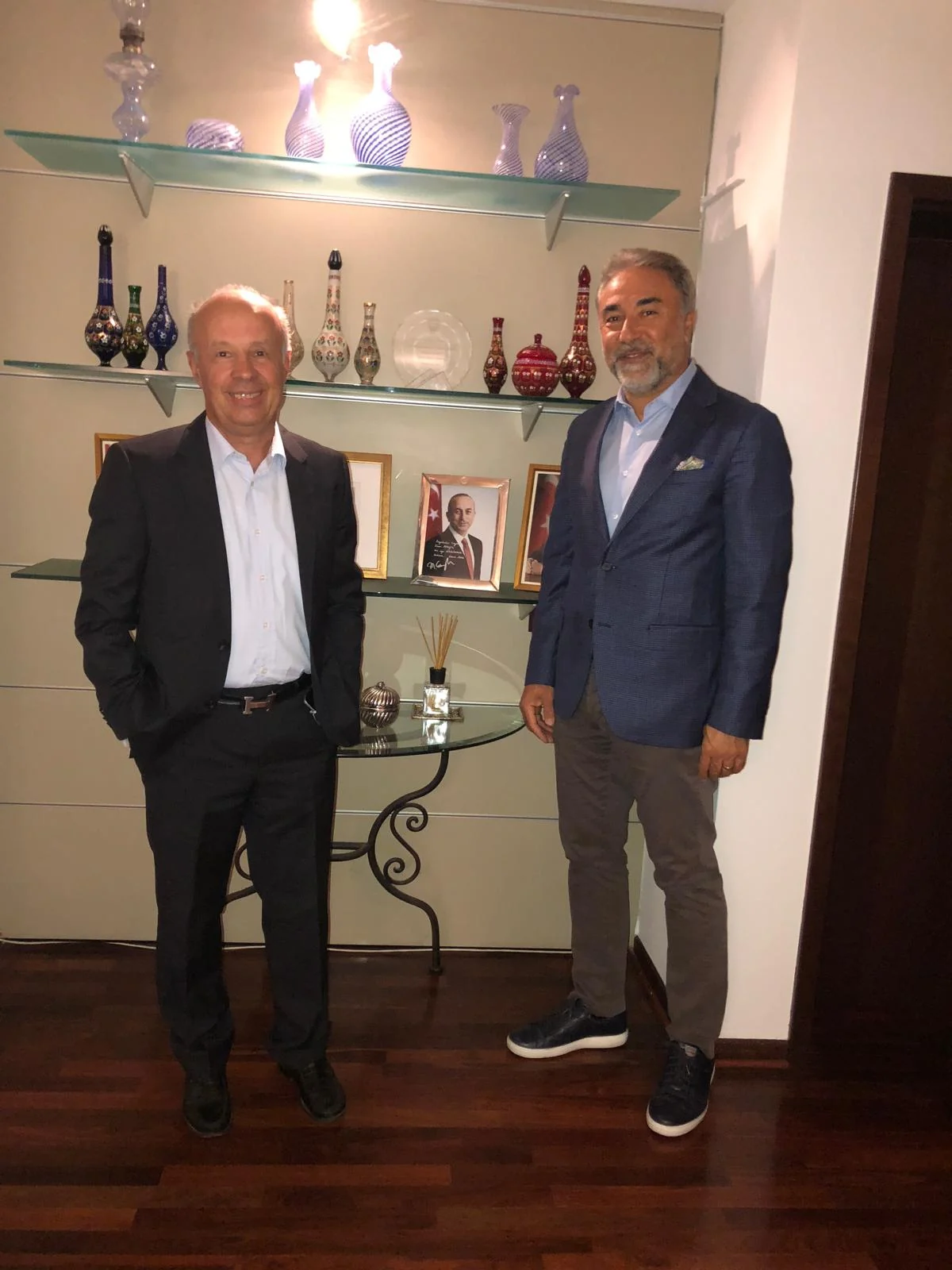 Eugen Mesares and Cahit Şahin standing together in an office setting